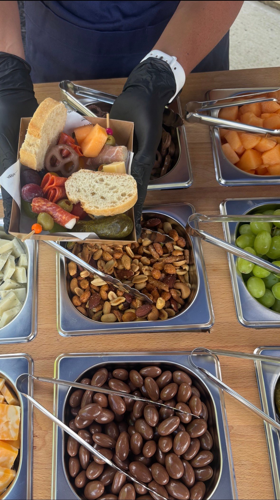 Close-up of a KeKe's Party Kart charcuterie graze box being served