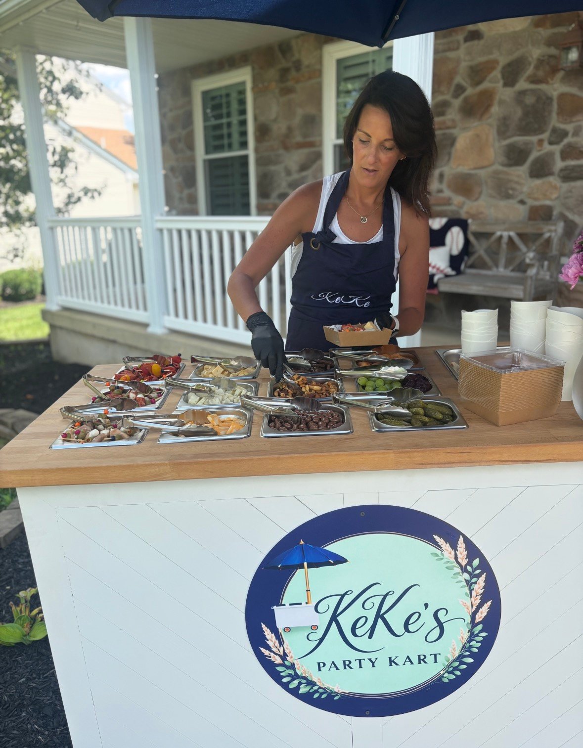 KeKe serving guests at the cart