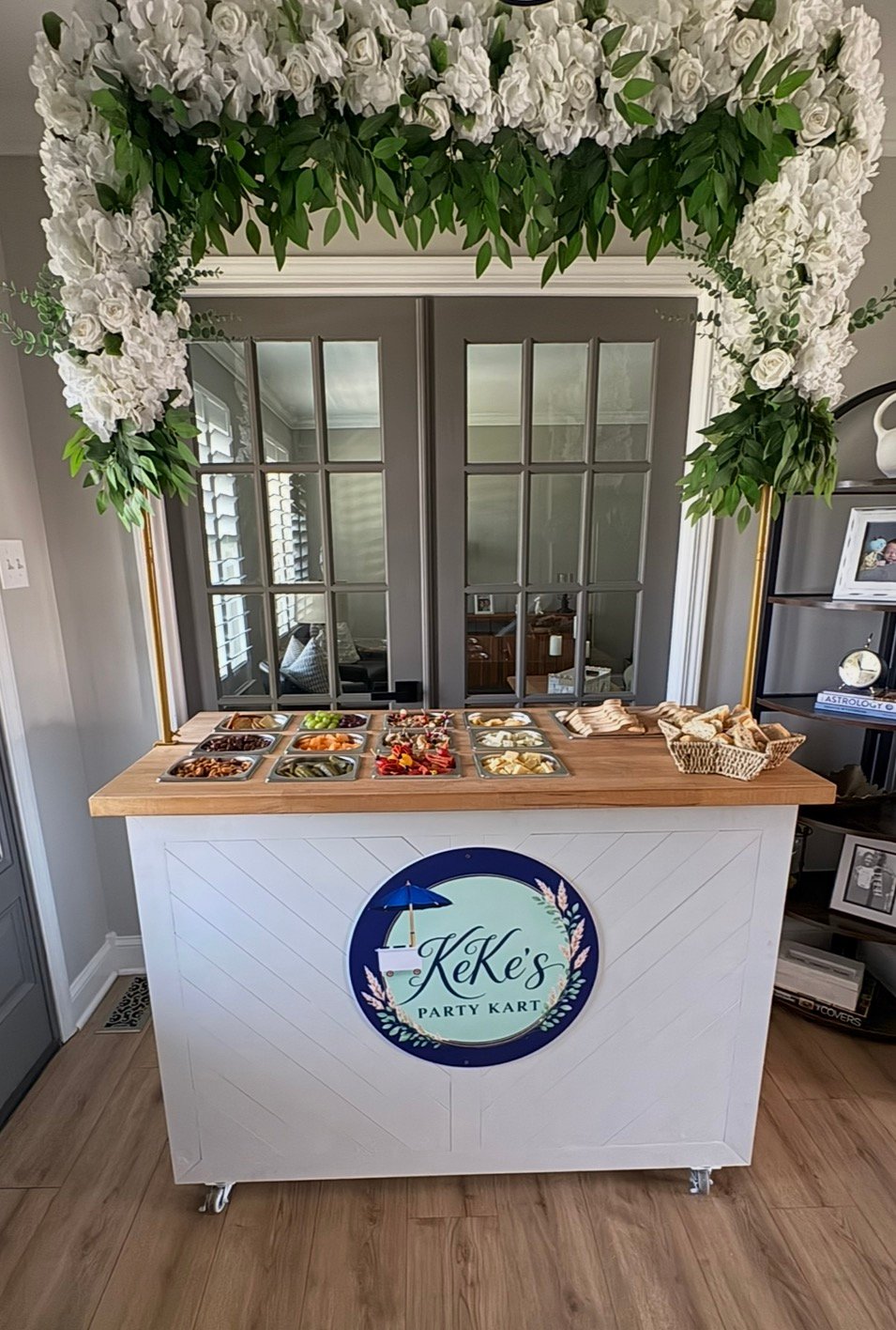 KeKe's Party Kart floral arch charcuterie display